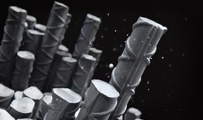 Cover image for Steel rebar and spooled rebar manufactured from steel scrap